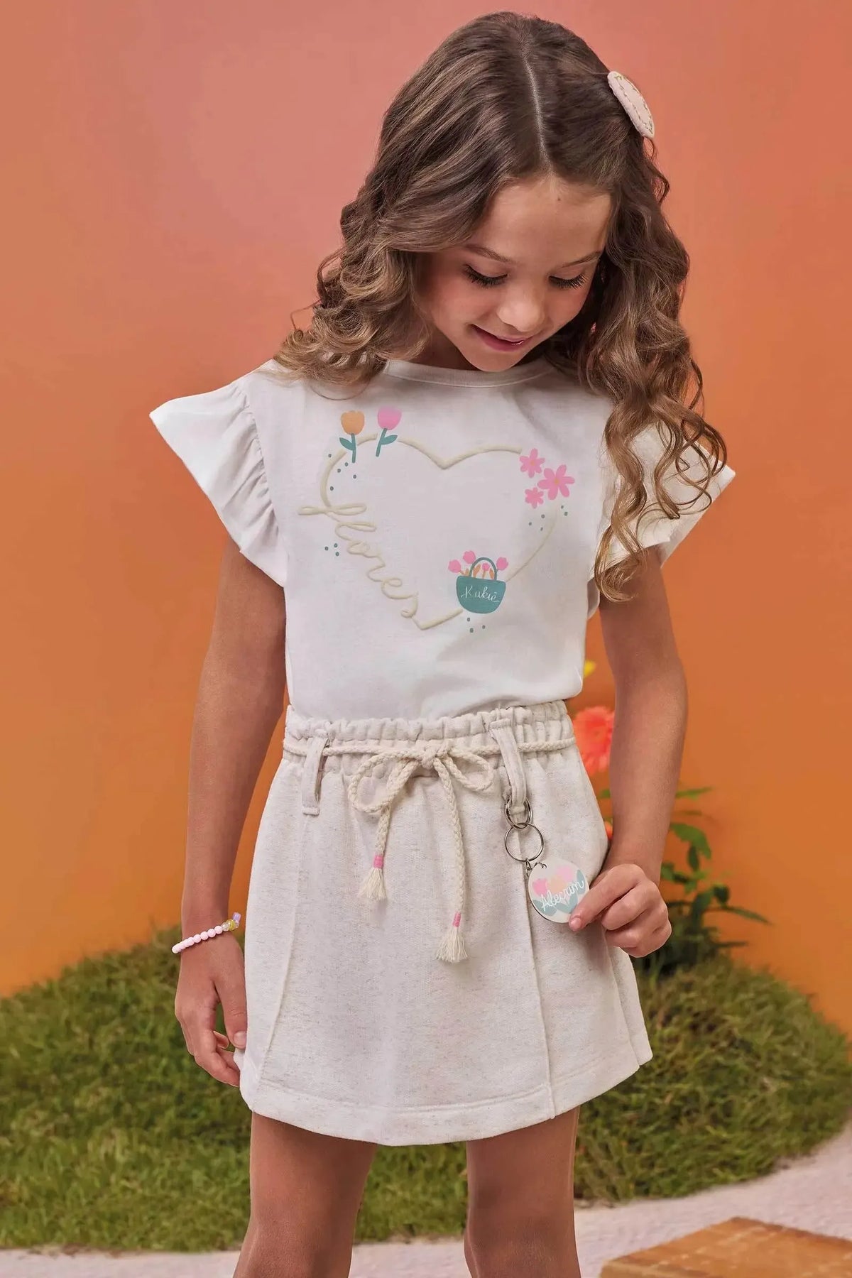 Conjunto de Blusa em Meia Malha e Short Saia em Moletom sem Pelúcia 99586 Kukiê Infantil Menina