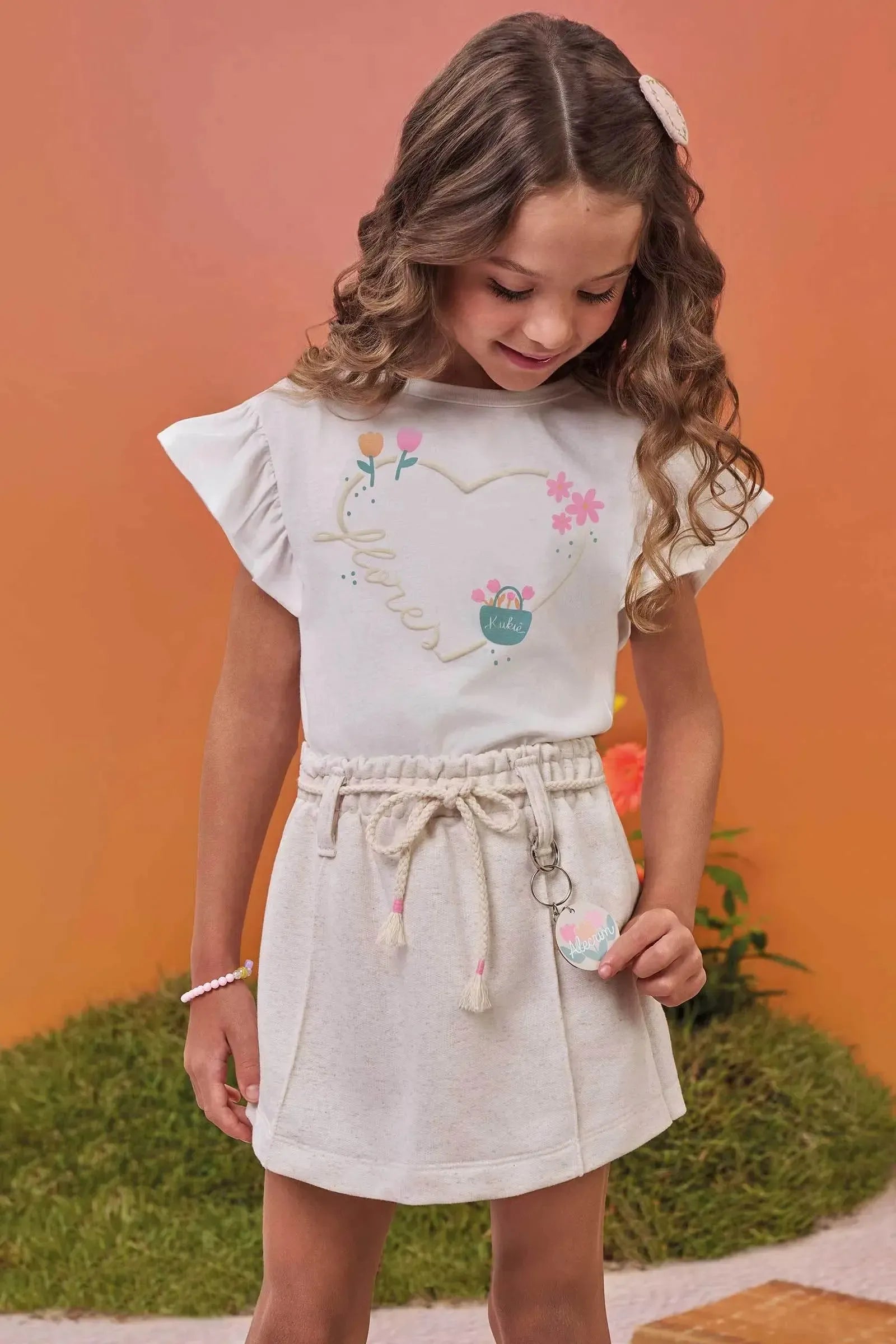 Conjunto de Blusa em Meia Malha e Short Saia em Moletom sem Pelúcia 99586 Kukiê Infantil Menina